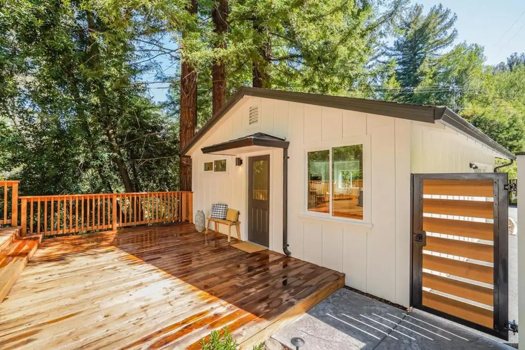 Detached backyard unit with a redwood deck under the trees, Woodland Drive project